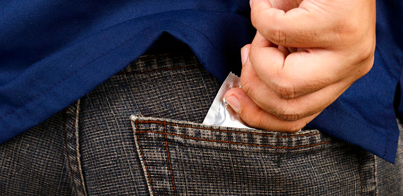 Image of condom in pocket. Photo Credit: Copyright: leolintang / 123RF Stock Photo