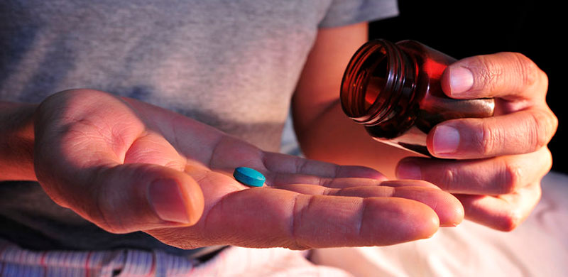Image of blue pill in hand. Photo Credit: Copyright: nito500 / 123RF Stock Photo